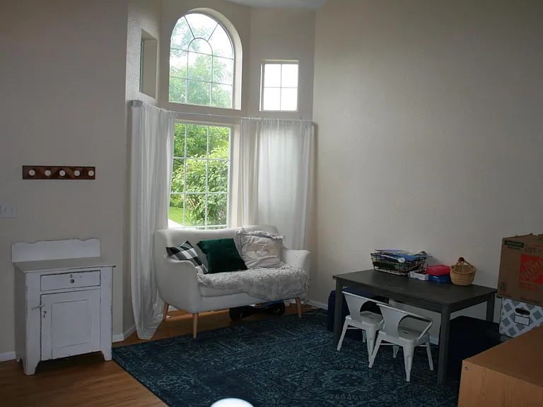 vaulted ceilings and hardwood floors in living room