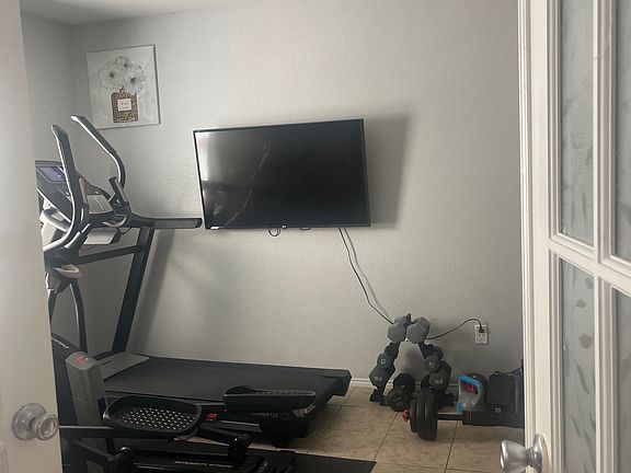 When you walk in home this office/exercise room or bedroom is on the left