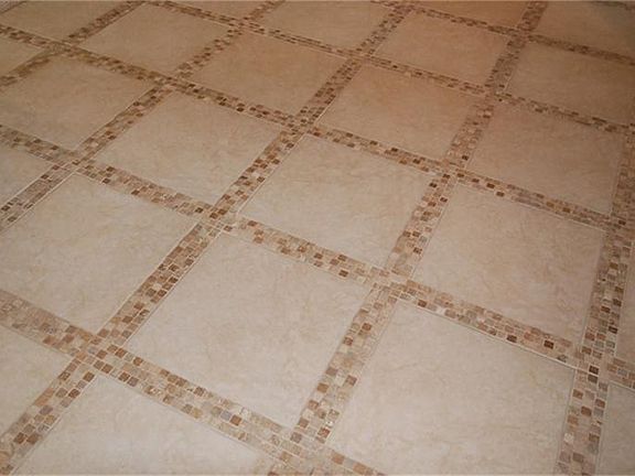Close up view of custom tile work in foyer.