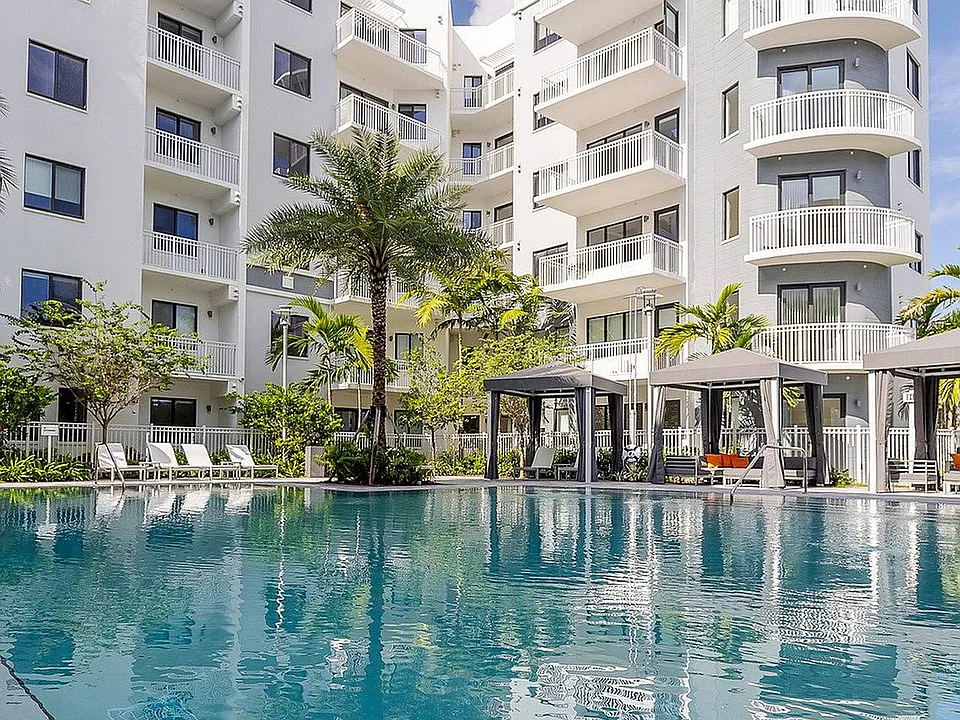 Resort style swimming pool with cabanas