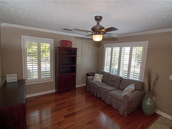 The living are is open to the kitchen. All furniture depicted in this photograph to remain in the home.