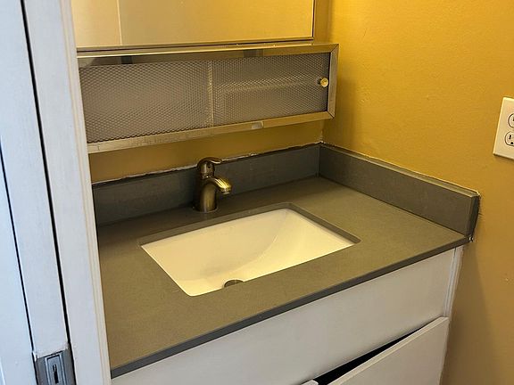 1/2 bathroom sink and toilet.