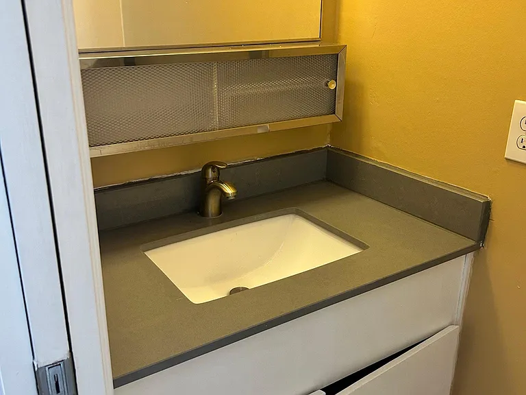 1/2 bathroom sink and toilet.
