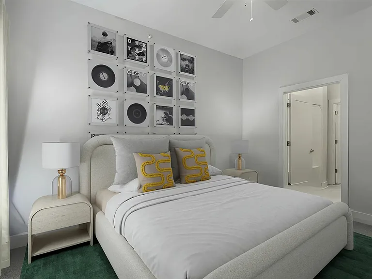 Welcoming bedroom at The Melrose Apartments in South Nashville, featuring direct access to a spacious bathroom and a walk-in closet.