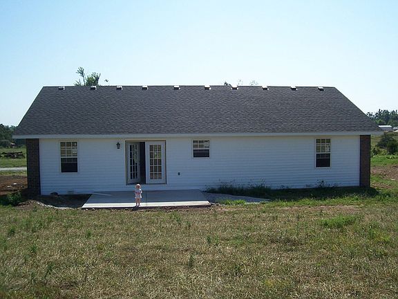 Back of home with Patio that faces West