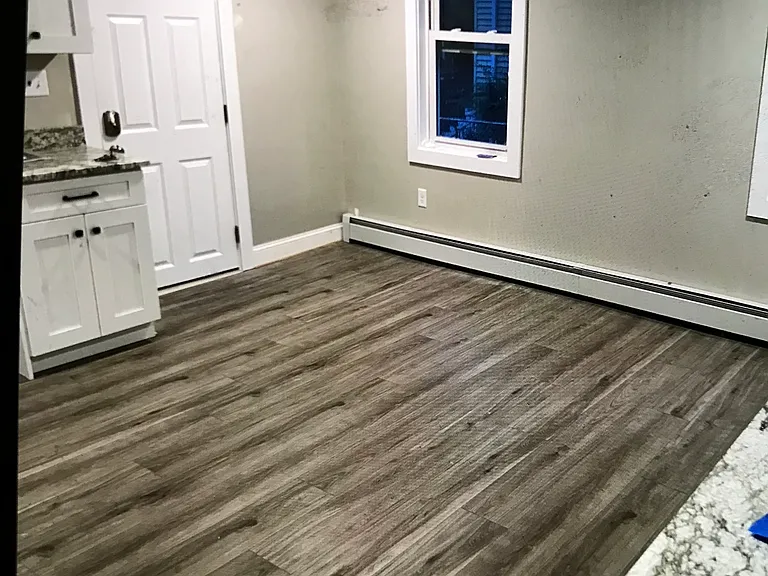 New eat-in kitchen with new appliances, flooring and dishwasher