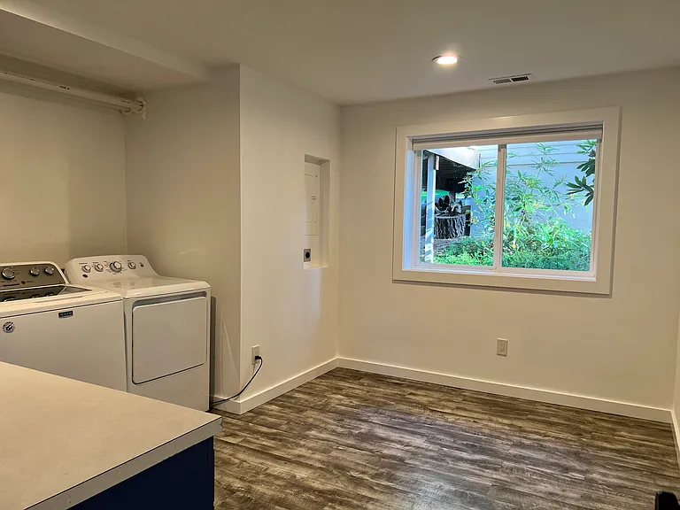 Spacious laundry room with room for additional storage, organization, and household essentials.