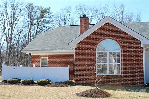 The partial brick exterior is traditional in style, and welcomes visitors to your home!
