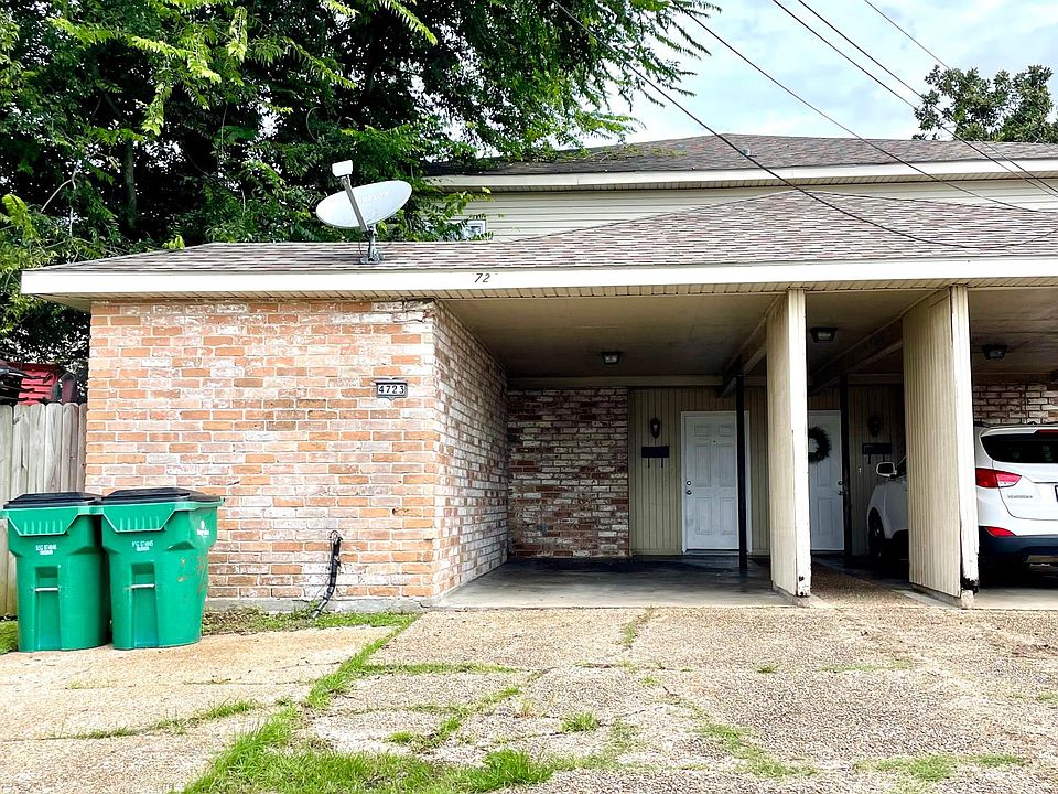 Driveway, carport, and front door.