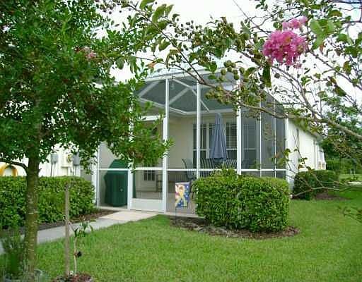 large screened patio leading to 2 car garage