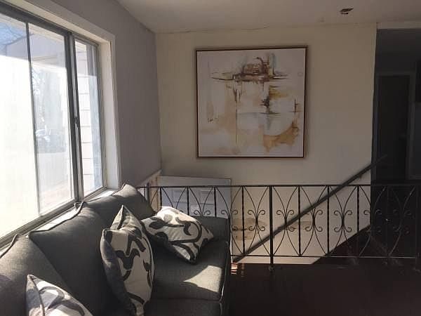 fist of two large window in living room one on each side