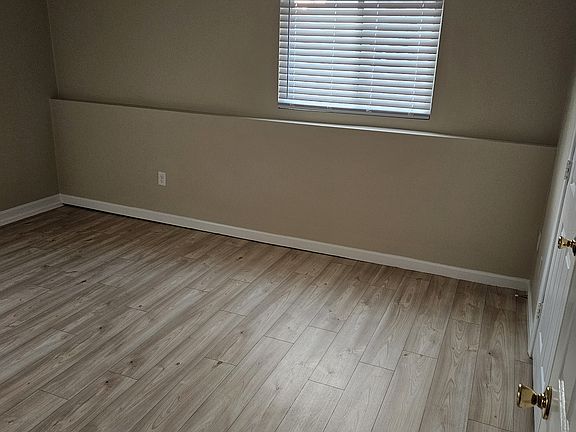 Large bedroom with walk-in closet and two windows