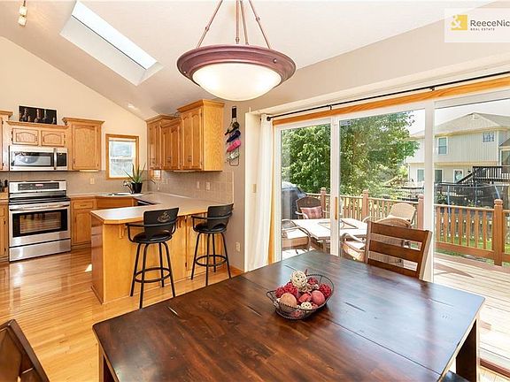 Kitchen and Dining Walk Out To A Large Deck and Patio