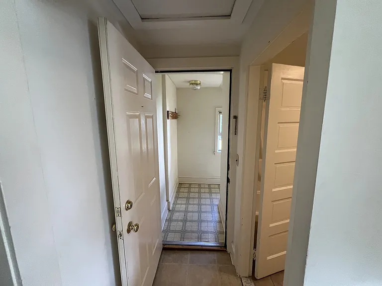Entry area from the common hallway that leads into the second floor unit.