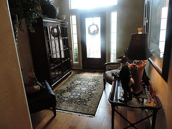 Stunning entry! Designer Paints*Leaded Glass Door and Rich wood floors!