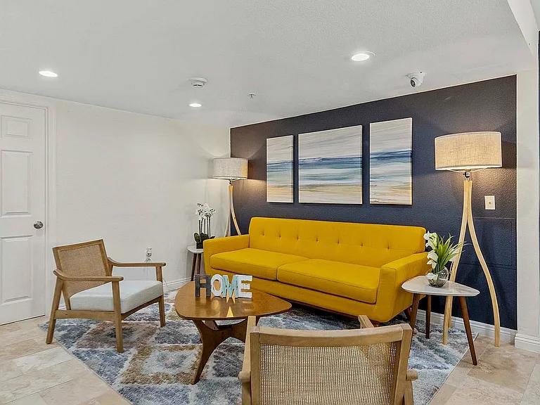Step into this chic and inviting living space, perfect for relaxation and entertainment.