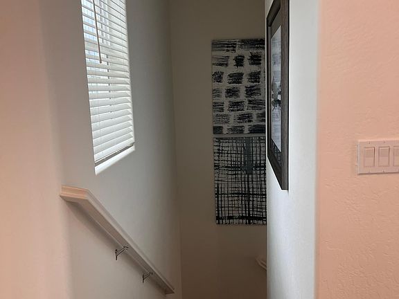 Stairs to 2nd floor (model home picture provided for reference along with the actual home)