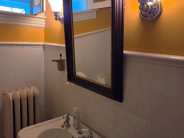 Antique bathroom mirror included with apt use