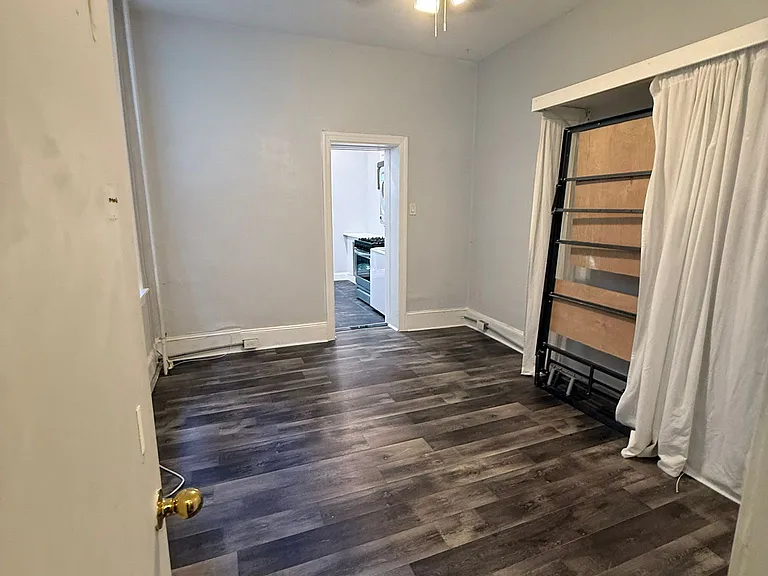 View from main room bathroom towards room & kitchen