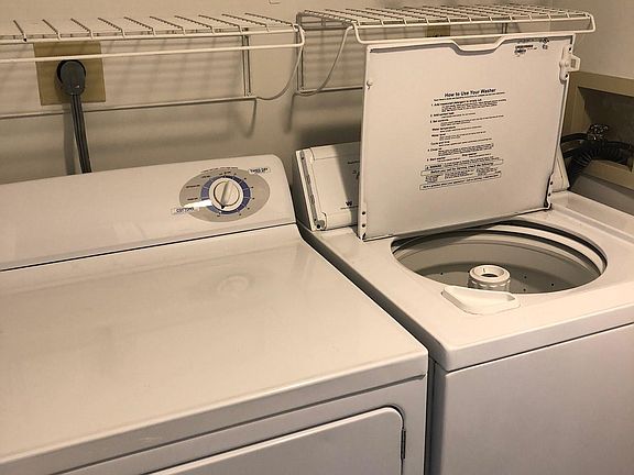 Full sized laundry washer and dryer in unit