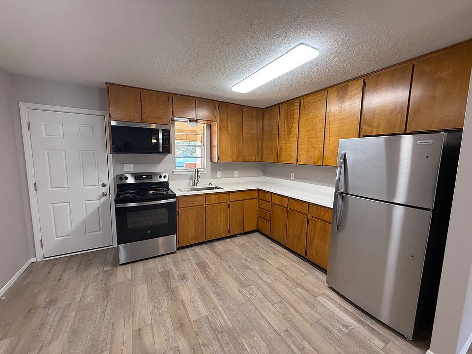 New Quartz Counter Top with deep single bowl sink; new appliances