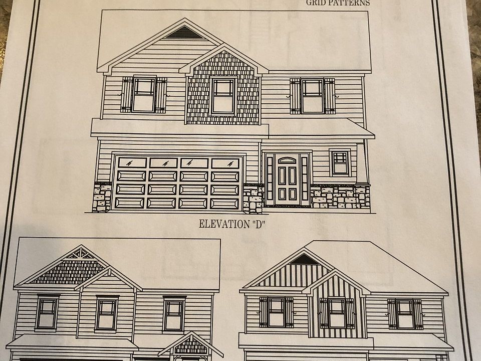 Exterior Elevation this home is elevation D . Hardie board and stone combination