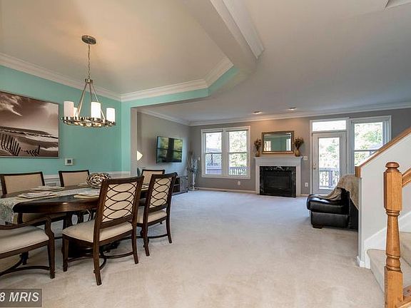Main level has big windows and gas fireplace