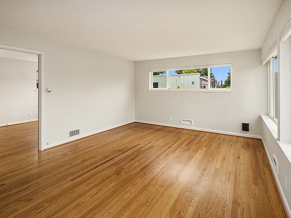 huge Living area with tons of natural light - corner end unit with windows in every room. All the little touches to make living here lovely - like top down/bottom up blinds in Living room.