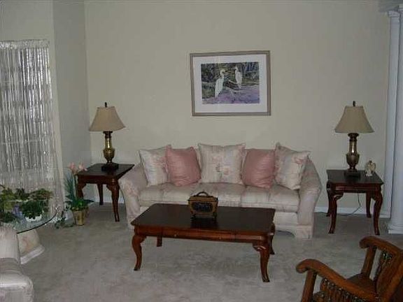 Living room/dining room combination is open and sunny!
