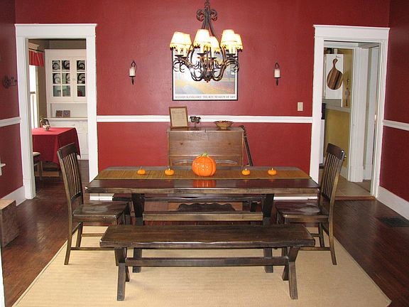 Dining Room with High Ceilings, Hardwood Floors & Crown Molding!