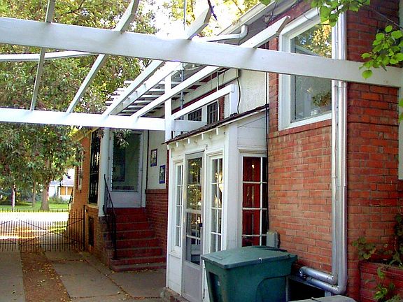 Entrance to apartment right next to green can