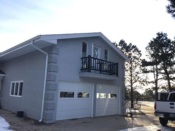 Unit includes a private Juliette balcony with outdoor seating.