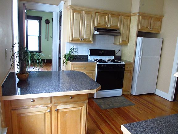 Kitchen - gas stove; door leading into dining room