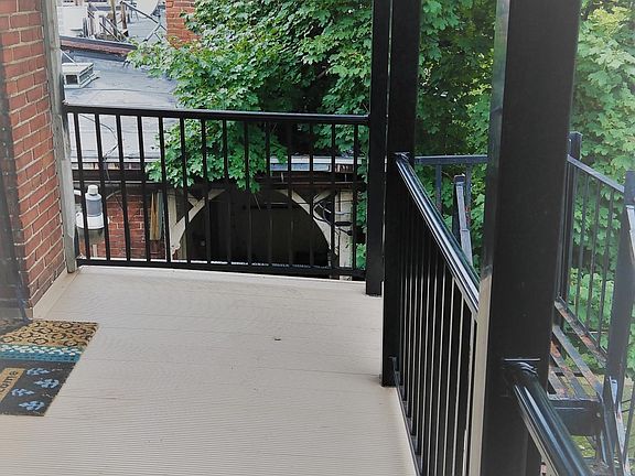 New rear balcony with access to shared patio.