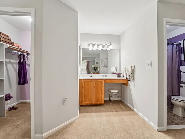 2 Bedrooms, 2 Full Bathrooms, 1147 Square Feet - Primary Bedroom's Walk-in Closet with Shelving, Separate Vanity Area, Private Full Bathroom