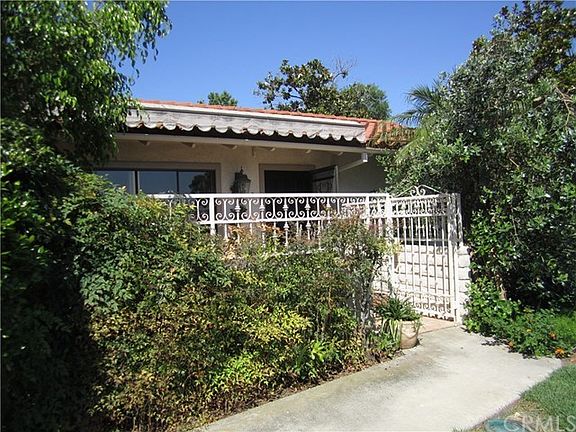 Entrance from corner location with private area in front of patio