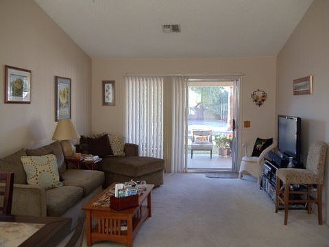 TV room leading to covered patio