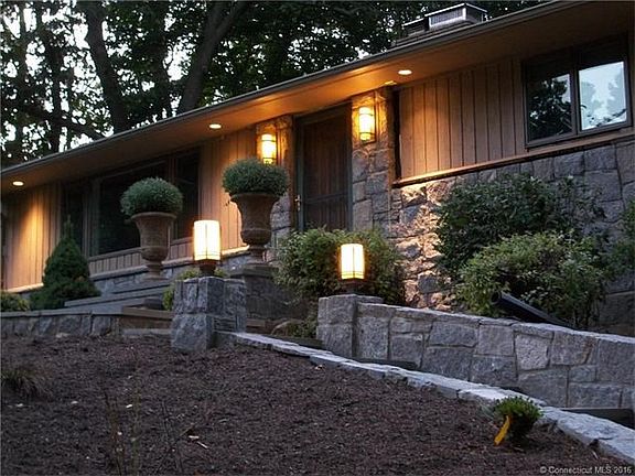 Exterior features professionally designed outdoor lighting.