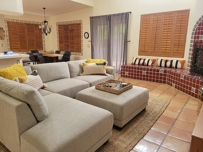 Spacious open living space with large screen TV.