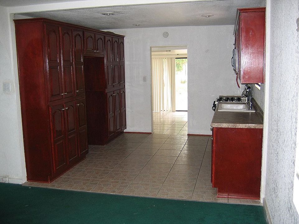 Large kitchen with lots of cabinets.