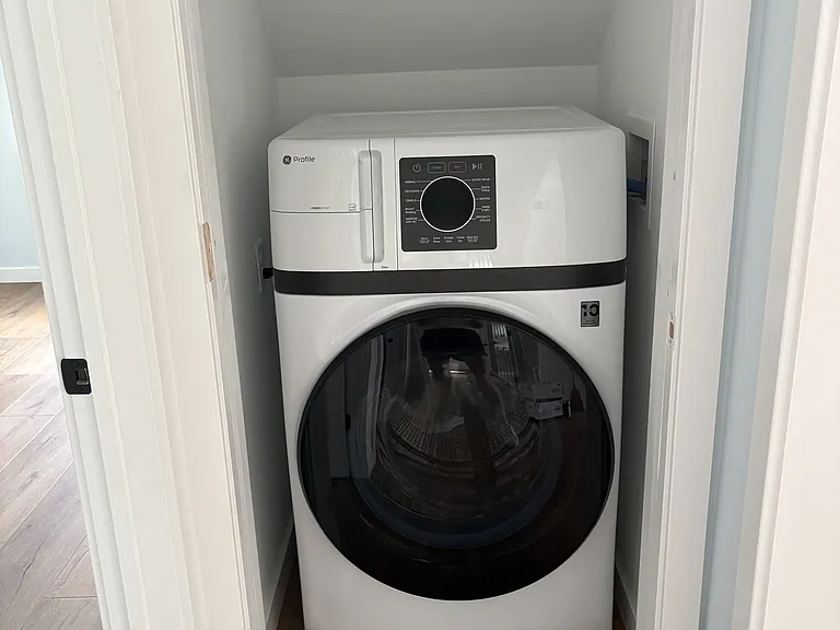 All in one washer dryer combination in laundry closet