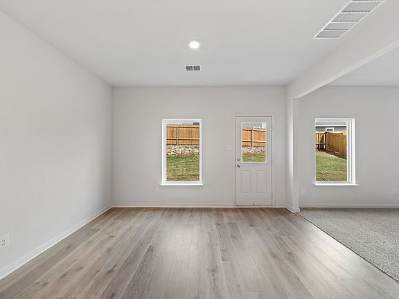 The dining room sits right off of the kitchen