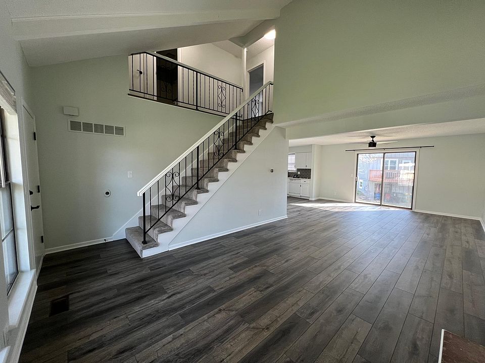 Living room/front door/stairs/dining room/kitchen