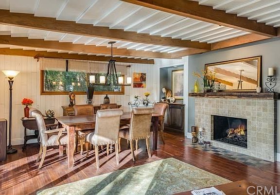 Beautiful custom stone fireplace off the living/ dining areas. Gorgeous wood flooring!