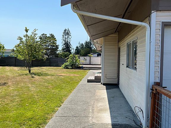 This photo is from the left side of the garage facing the deck off the dining area.