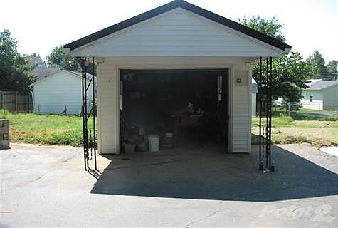 Detached garage behind the house!  And spacious 3/4 acre lot!