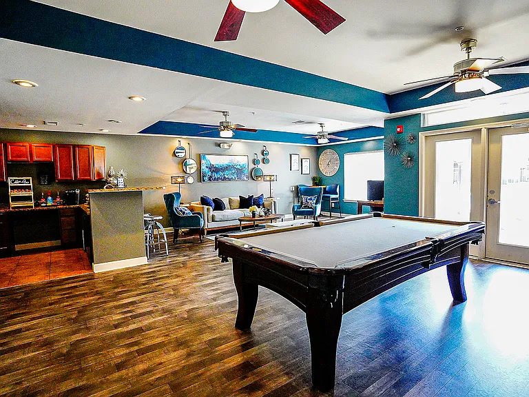 The Reserve's clubhouse includes billiards, a coffee bar, and entertainment/lounge space.