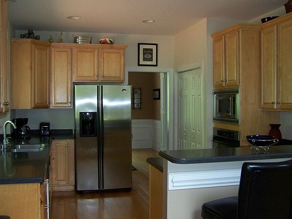 Custom maple cabinets withGE profile stainless appliances