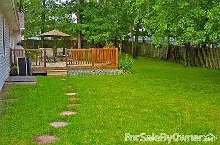 Back yard : Private expansive fenced back yard with storage shed and oversized deck.