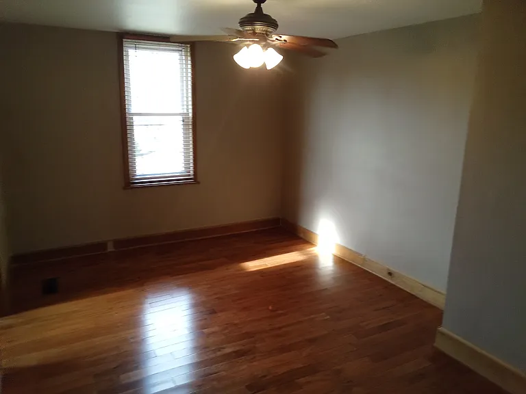 freshly painted larger bedroom is 12x15 and has a small walk in closet